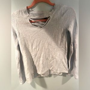 American eagle sweater like top. Cross cross pattern in front bell sleeves.